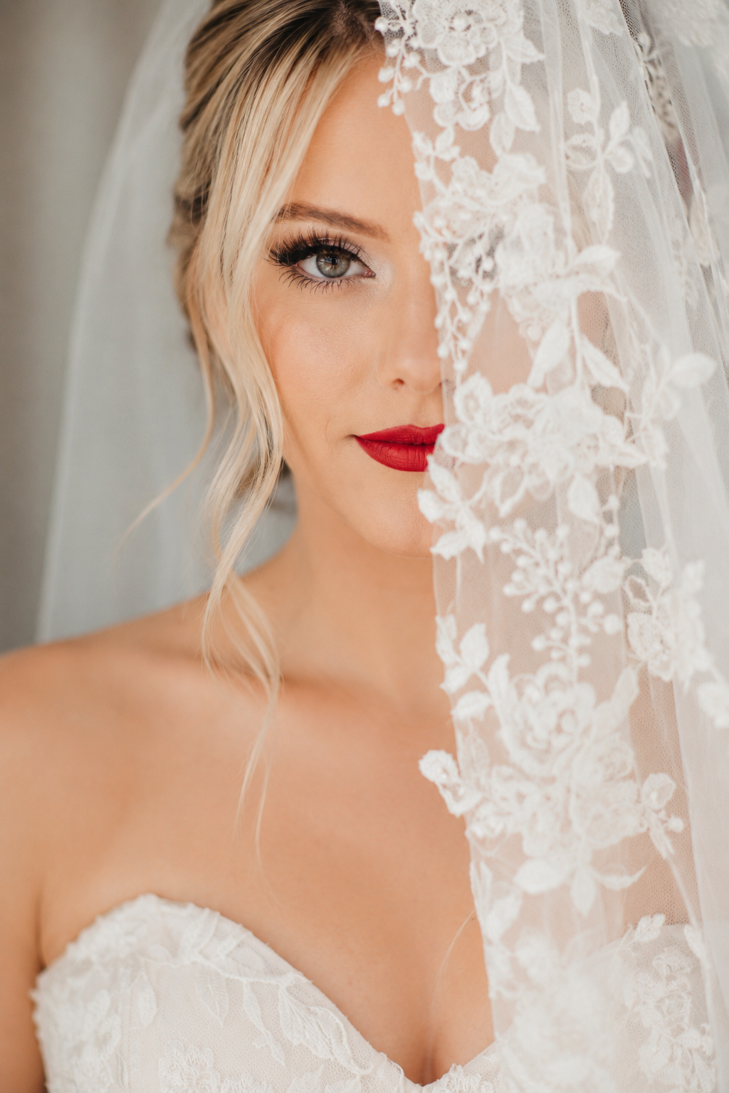 Mobile bridal hair and makeup bride with elegant red lipstick